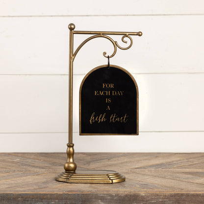 BLACK & GOLD HANGING SIGN ON STAND